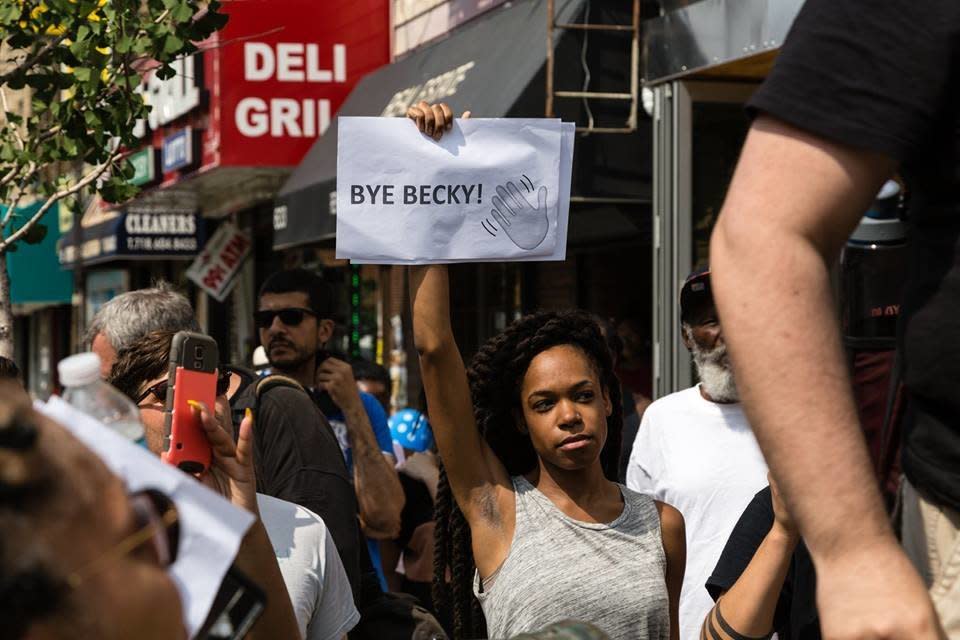 Organizer Justine Stephens holds up a sign that reads "Bye, Becky!" (Photo: Mo Gelber)