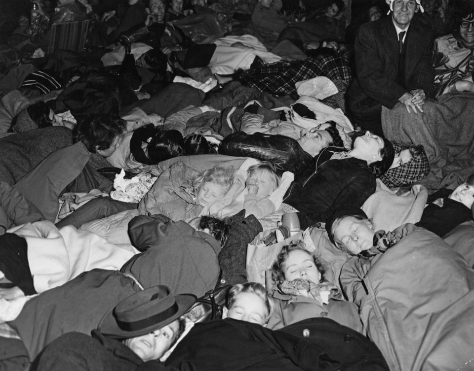 People attempt to sleep while camping out on the Mall in Westminster ahead of the coronation  back in 1953. (Getty Images)