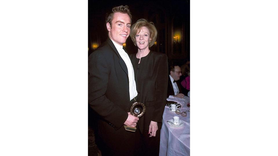 Toby Stephens holding an award with his mum Dame Maggie Smith