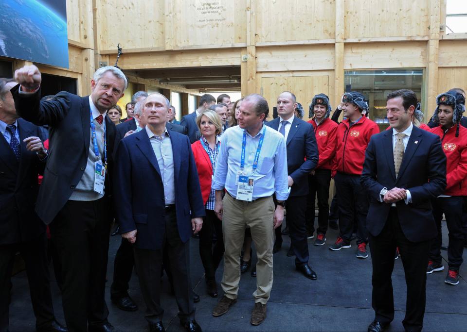 Russian President Vladimir Putin, second left, visits House of Switzerland in Sochi, Russia, Saturday, Feb. 15, 2014. (AP Photo/RIA-Novosti, Mikhail Klimentyev, Presidential Press Service)