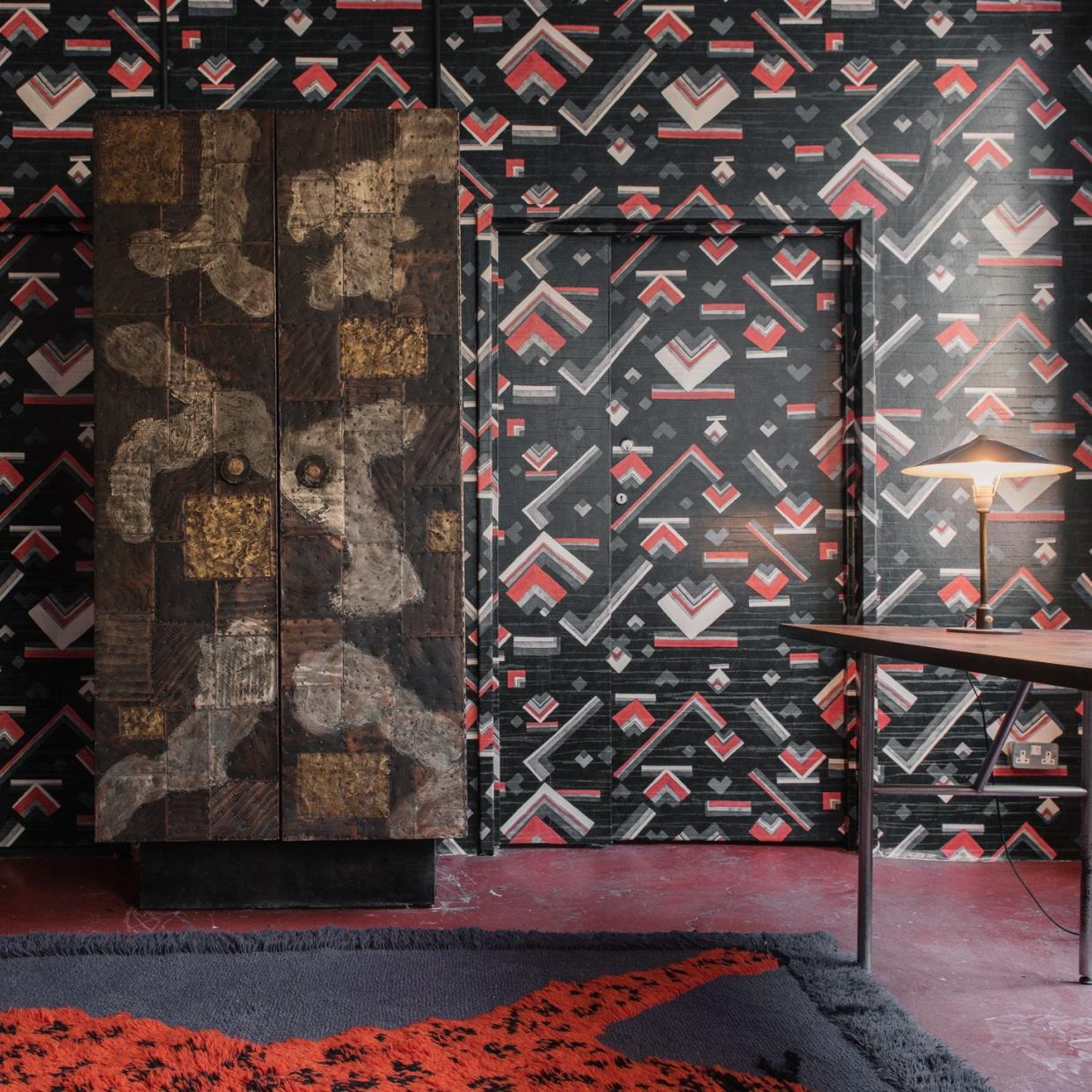 The entrance at ONEROOM with “Concorde” wallcovering by Dedar alongside a 1970s wardrobe by American designer Paul Evans. The “Tapipardo” rug is designed by Gabetti and Isola in the 1970s. The 1960s table is designed by George Nelson with a walnut top on a cantilevered brushed steel frame. - SimoneLezzi