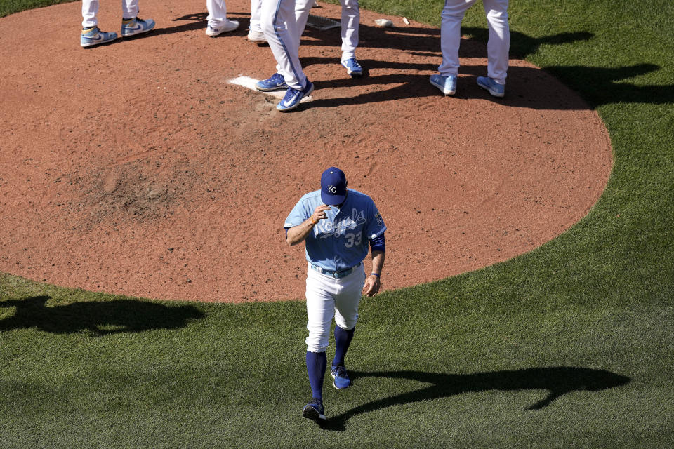 Kansas City Royals manager Matt Quatraro (33) walks backs to the dugout after making a pitching change during the sixth inning of a baseball game against the Washington Nationals Saturday, May 27, 2023, in Kansas City, Mo. (AP Photo/Charlie Riedel)