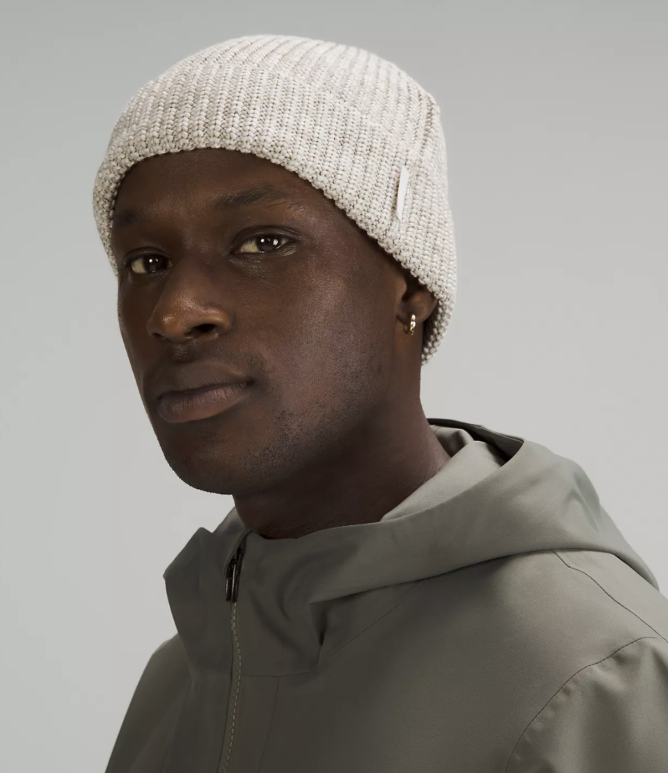 male model wearing light grey Close-Fit Cotton-Blend Ribbed Beanie (photo via Lululemon)