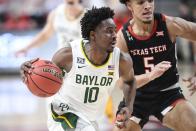 Baylor's Adam Flager (10) controls the ball during the second half of an NCAA college basketball game against Texas Tech in Lubbock, Texas, Saturday, Jan. 16, 2021. (AP Photo/Justin Rex)