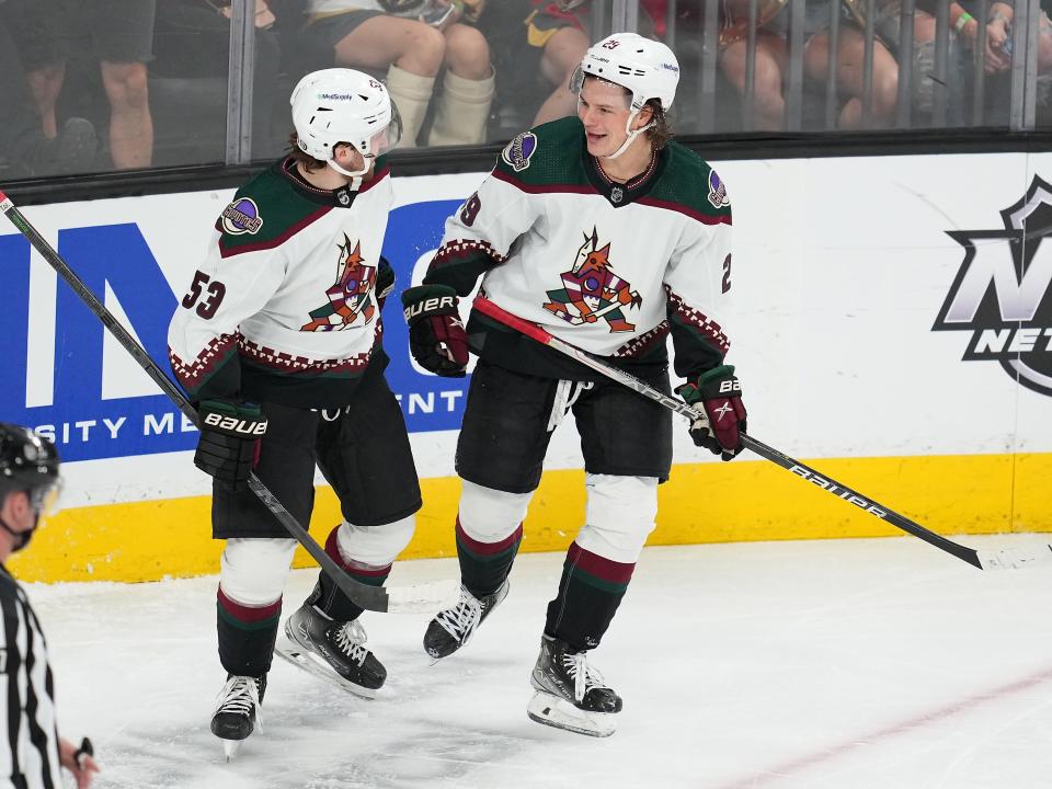 Apr 9, 2022; Las Vegas, Nevada, USA; Arizona Coyotes center Barrett Hayton (29) celebrates with left wing Michael Carcone (53) after scoring a goal against the Vegas Golden Knights during the first period at T-Mobile Arena.