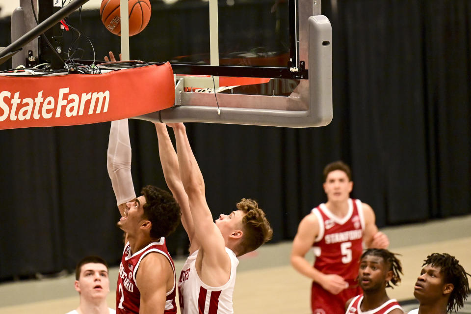 Stanford forward Jaiden Delaire (11) attempts a shot as Washington State forward Aljaz Kunc (4) defends during the first half of an NCAA college basketball game, Saturday, Feb. 20, 2021, in Pullman, Wash. (AP Photo/Pete Caster)