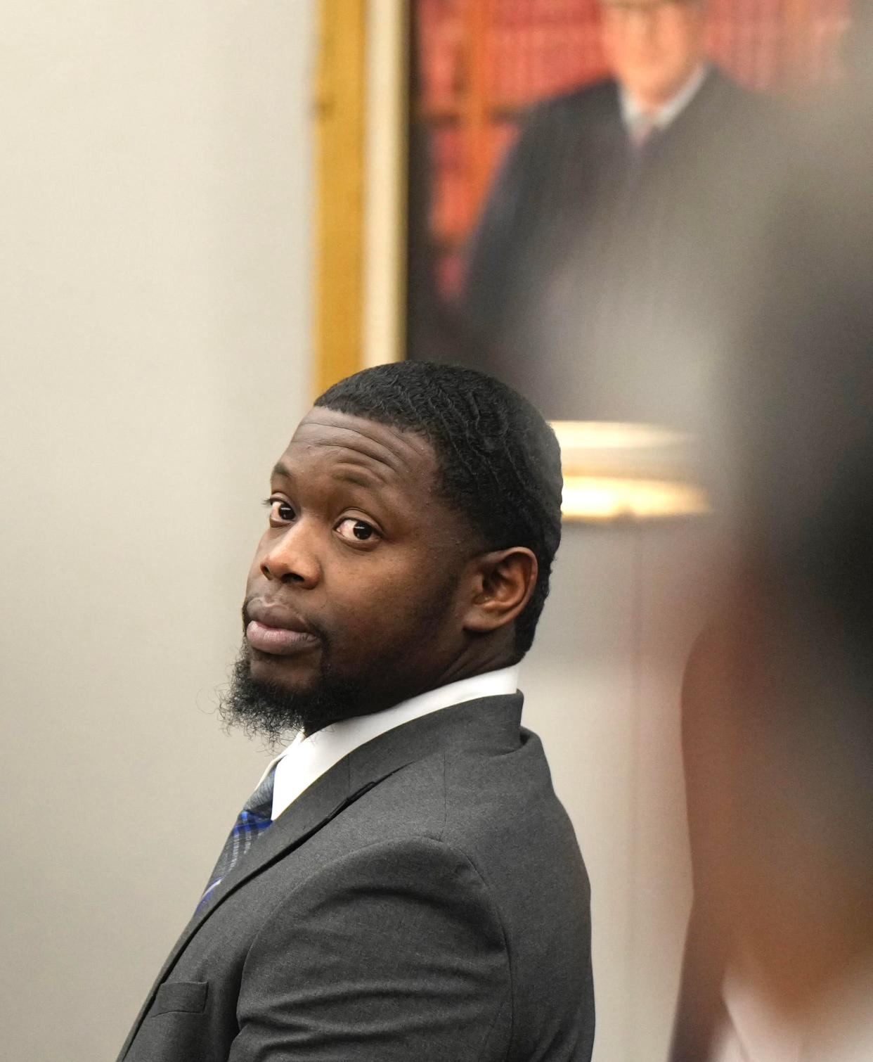 Othal Wallace turns as his trial begins in the Clay County Courthouse Monday, Sept. 11, 2023. Wallace is on trial for the murder of Daytona Beach Police officer Jason Raynor.