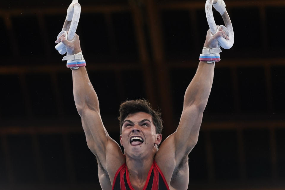 The Russian Olympic Committee's Artur Dalaloyan performs on the rings during the men's artistic gymnastic qualifications at the 2020 Summer Olympics, Saturday, July 24, 2021, in Tokyo. (AP Photo/Gregory Bull)