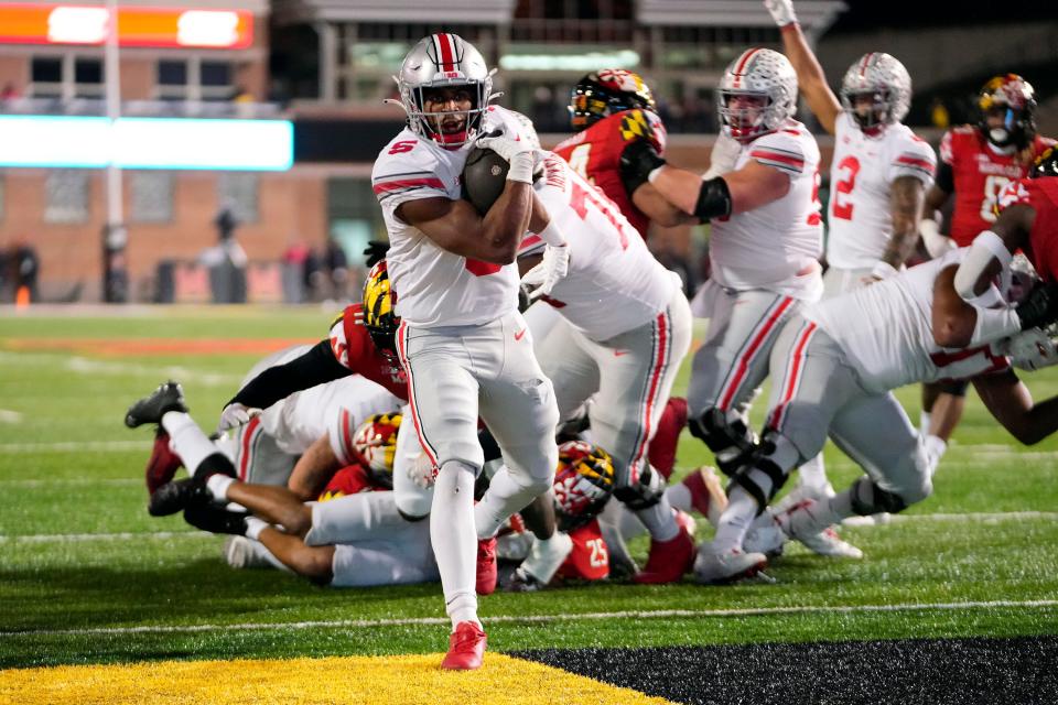 Nov 19, 2022; College Park, MD, USA; Ohio State Buckeyes running back Dallan Hayden (5) scores a rushing touchdown against Maryland Terrapins in the third quarter in their Big Ten game at SECU Stadium. 