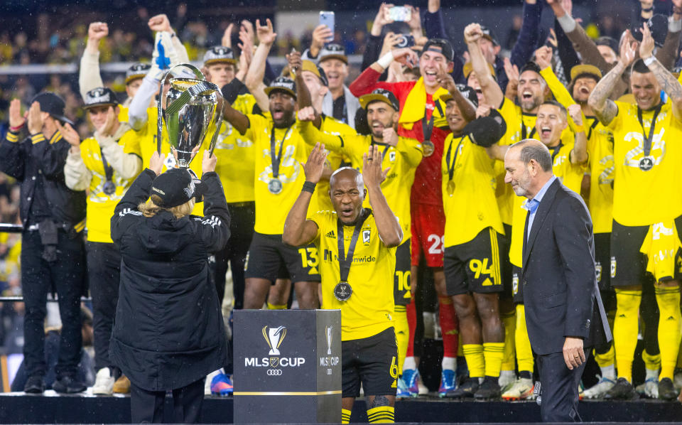 COLUMBUS, OH - DECEMBER 9: Darlington Nagbe #6 of the Columbus Crew and the rest of his team cheer as they raise the trophy after the Audi MLS Cup Final game between Los Angeles FC and Columbus Crew at Lower.com Field on December 9, 2023 in Columbus, Ohio. (Photo by Zach Sanderson/ISI Photos/Getty Images)