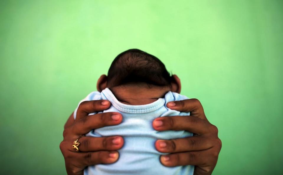 <div class="inline-image__caption"><p>Jackeline, 26, holds her son who is 4-months old and born with microcephaly, in front of their house in Olinda, near Recife, Brazil, February 11, 2016. Recent laboratory analyses identified Zika virus infections in three people who died in Brazil last year, the health ministry said on Thursday, although authorities could not confirm that Zika alone was responsible for their deaths. </p></div> <div class="inline-image__credit">Nacho Doce/Reuters</div>