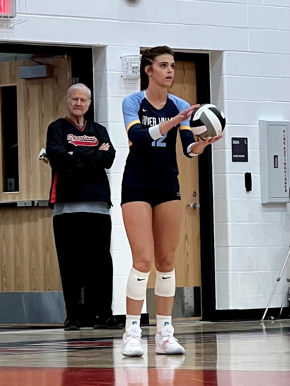 River Valley's Haleigh Creps gets ready to serve during a volleyball match at Pleasant this season. She set the school records for kills in a match and kills in season this year.