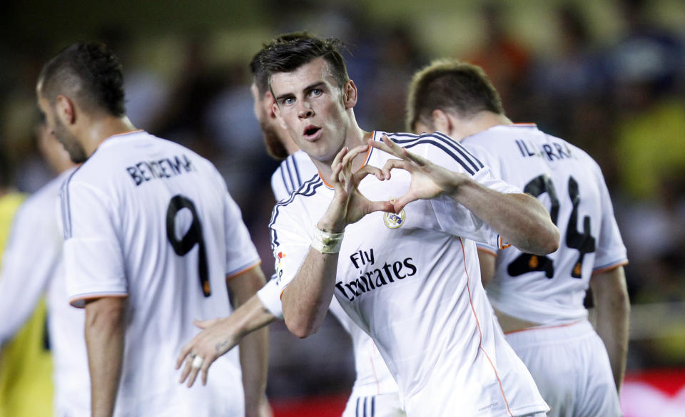 FILE - Real Madrid's Gareth Bale from Wales celebrates scoring against Villarreal during their La Liga soccer match at the Madrigal stadium in Villarreal, Spain, Saturday, Sept. 14, 2013. (AP Photo/Alberto Saiz, File)