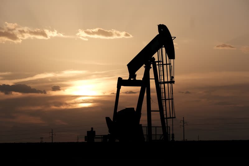 FILE PHOTO: Oil pump jacks work at sunset near Midland