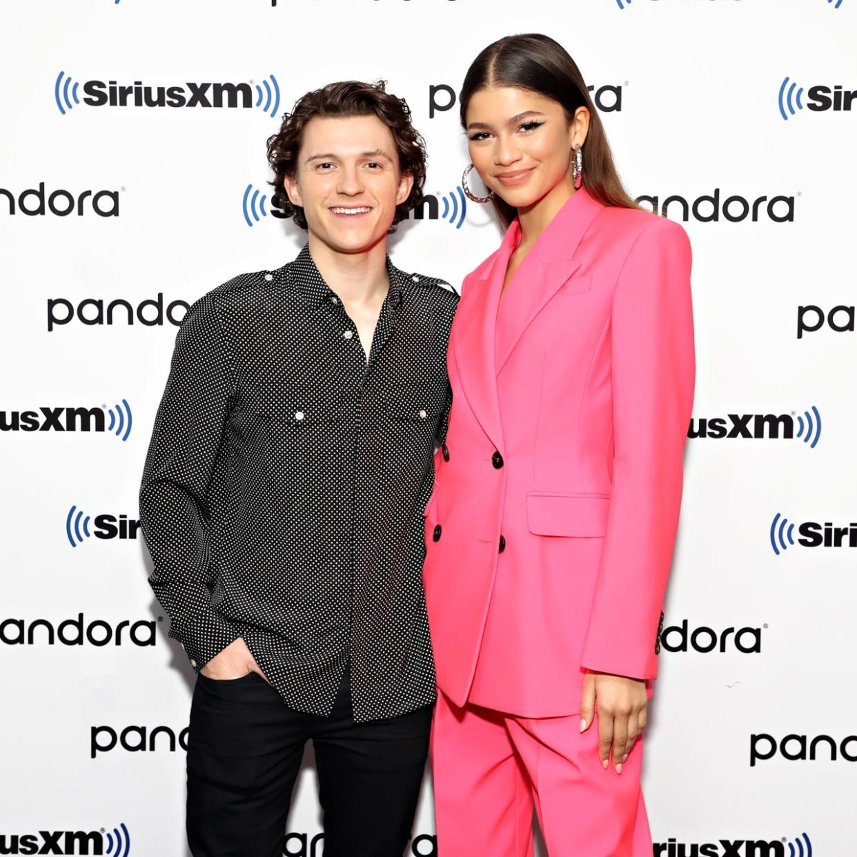  Zendaya and Tom Holland pose together on a red carpet 