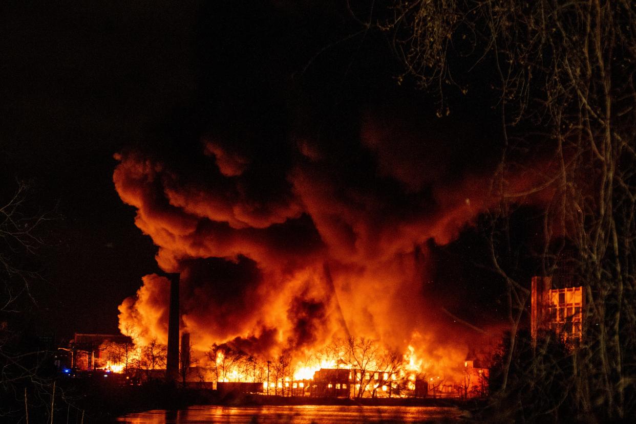 An 11-alarm chemical fire blazes across the Passaic River in Passaic, NJ on Friday Jan. 14, 2022.