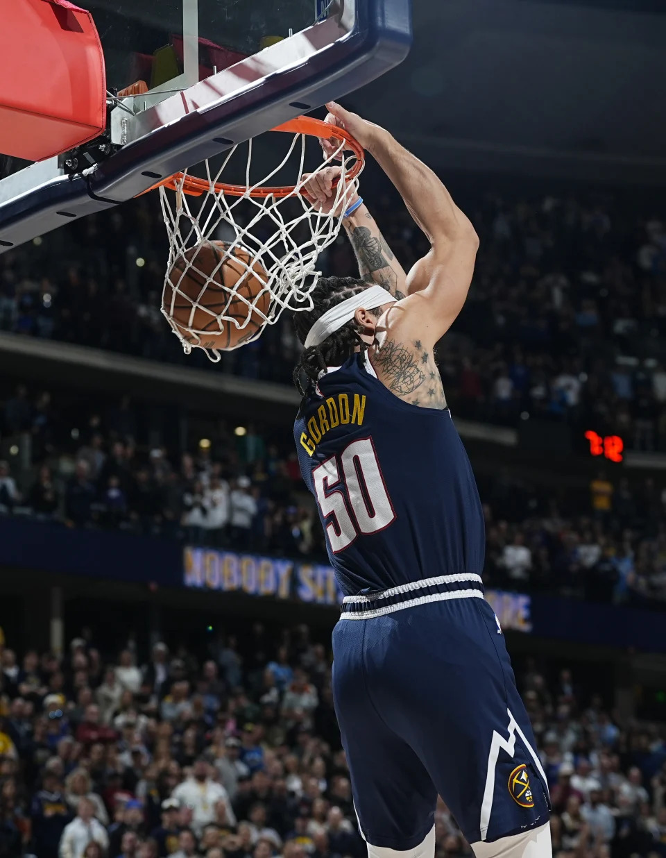 Denver Nuggets forward Aaron Gordon dunks against the Toronto Raptors in the first half of an NBA basketball game Monday, March 11, 2024, in Denver. (AP Photo/David Zalubowski)