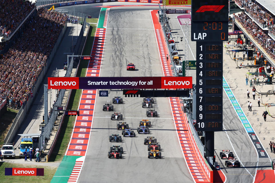 Charles Leclerc of Monaco driving the (16) Ferrari SF-23 and Lando Norris of Great Britain driving the (4) McLaren MCL60 Mercedes lead the field at the start during the F1 Grand Prix of United States at Circuit of The Americas (Mark Thompson / Getty Images)