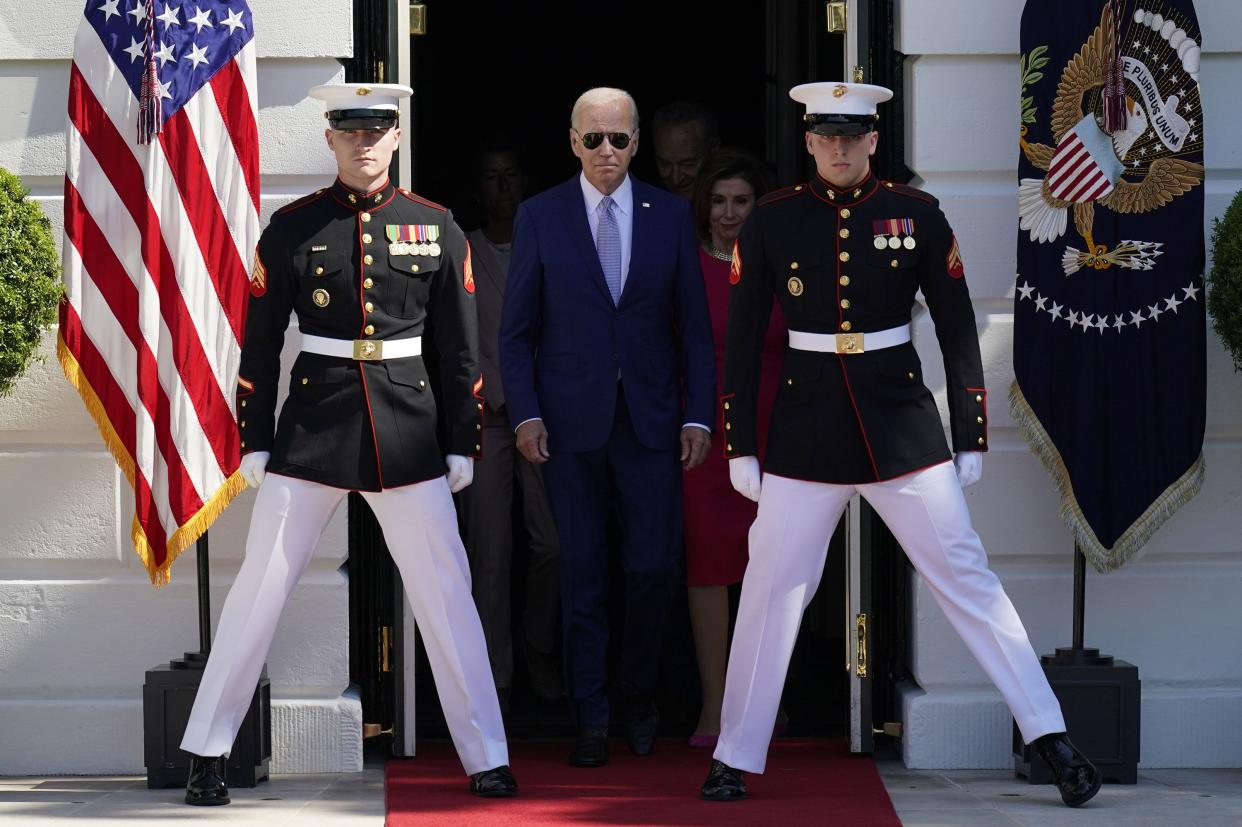 President Joe Biden walks out to the South Lawn to sign into law H.R. 4346, the CHIPS and Science Act of 2022, at the White House in Washington, Tuesday, Aug. 9, 2022.