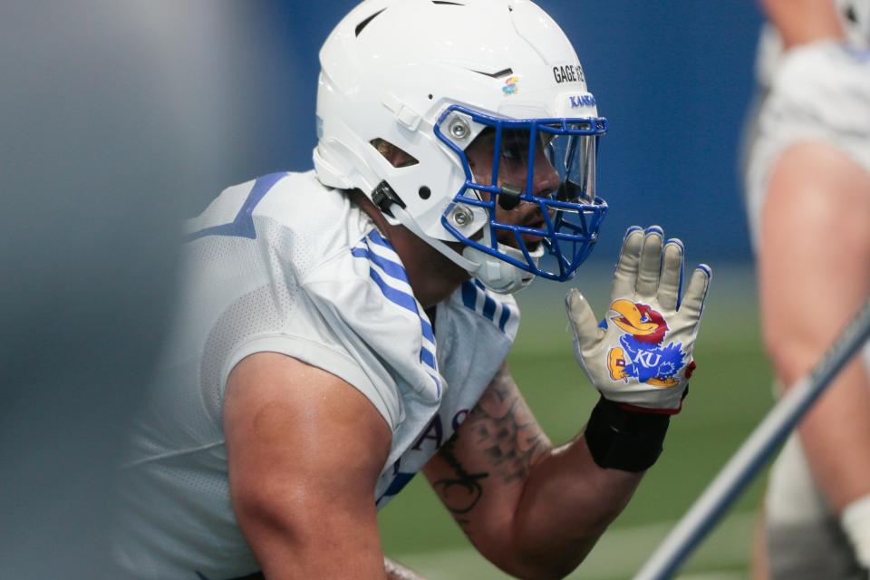 Kansas redshirt sophomore defensive lineman Gage Keys (17) lines up a play during Tuesday's practice inside Kansas' indoor practice facility. Keys is a transfer from Minnesota.