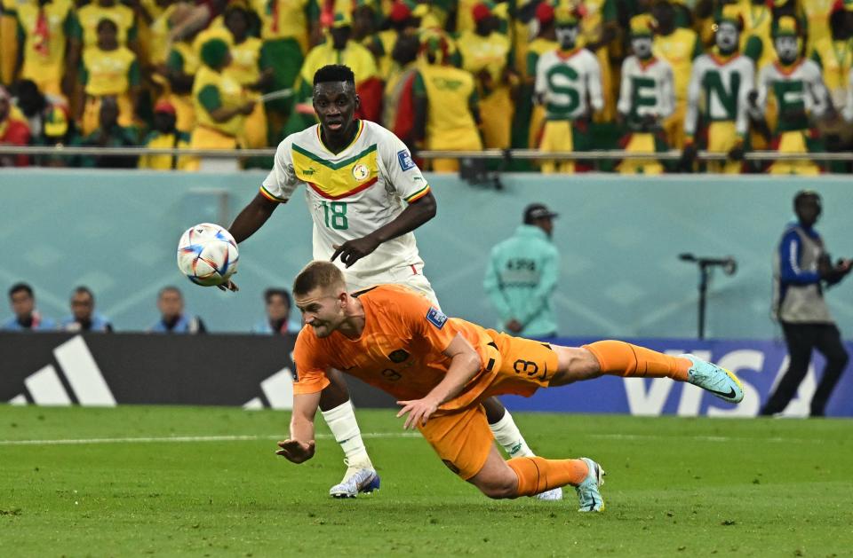 Matthijs de Ligt defends against Senegal’s Ismaila Sarr (REUTERS)