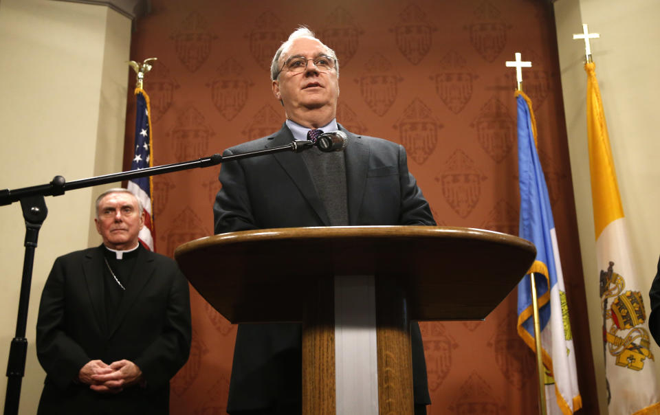 John O’Malley, attorney for the Archdiocese of Chicago, responds to a question about what the archdiocese knew about decades of clergy sex abuse allegations during a news conference Wednesday, Jan. 15, 2014, in Chicago. Standing behind O'Malley is Bishop Francis Kane, Auxiliary Bishop of Chicago. Victims’ attorneys, who have fought for years to hold the Catholic Church accountable for concealing crimes and sometimes reassigning priests to positions where continued to molest children, said they expect to receive the documents on Wednesday afternoon and make them public next week. (AP Photo/Charles Rex Arbogast)