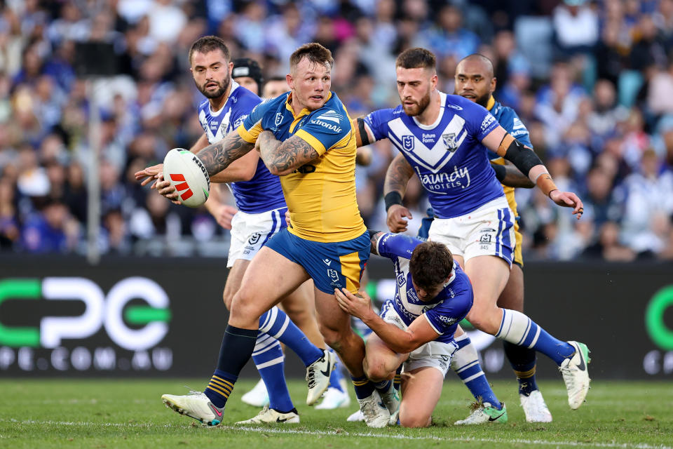 SYDNEY, AUSTRALIA - JUNE 10: J'maine Hopgood of the Eels runs the ball during the round 14 NRL match between Canterbury Bulldogs and Parramatta Eels at Accor Stadium, on June 10, 2024, in Sydney, Australia. (Photo by Brendon Thorne/Getty Images)