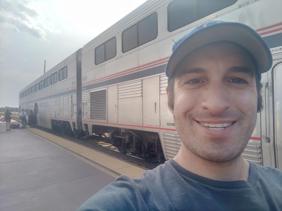 selfie of michael outside of a parked amtrak train