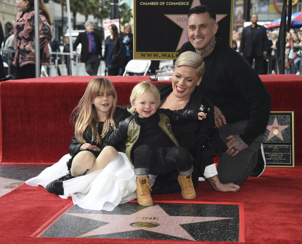Pink poses with her husband Carey Hart, and children Willow Sage, left, and Jameson at a ceremony honoring Pink with a star on the Hollywood Walk of Fame on Tuesday, Feb. 5, 2019, in Los Angeles. (Photo by Phil McCarten/Invision/AP)