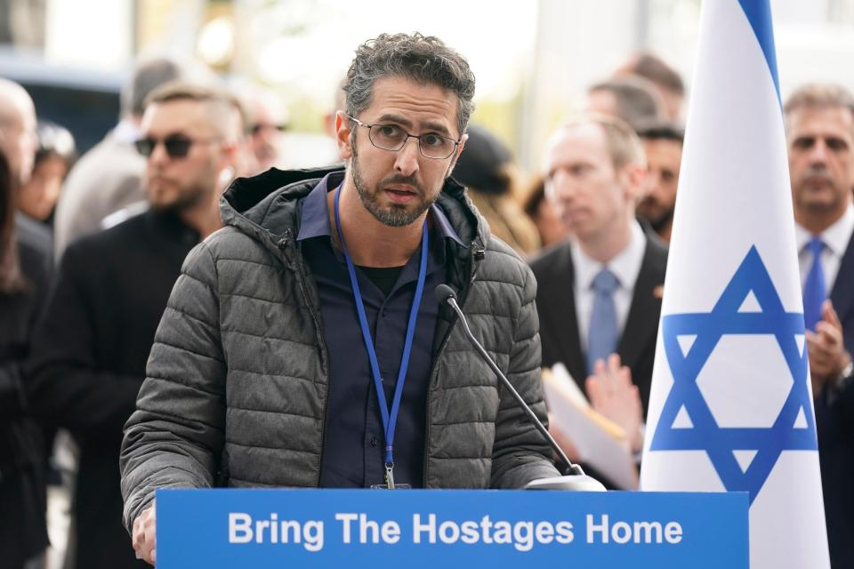 Moran Alony, who has two sisters and five other family members being held hostage by Hamas, speaks during a rally in front of United Nations headquarters in New York, Tuesday, Oct. 24, 2023.