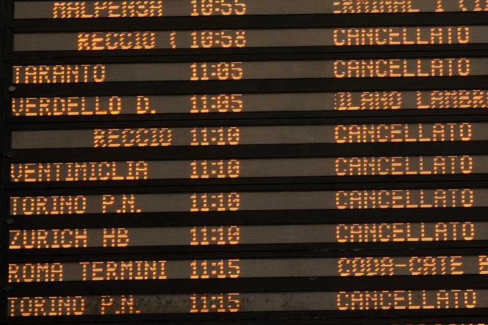 A billboard displays canceled trains at Milan central station during a national train strike, Thursday, July 13, 2023. Trenitalia and Italo train workers are on strike to demand better working conditions and training. in Milan, Italy, Thursday, July 13, 2023. (AP Photo/Luca Bruno)