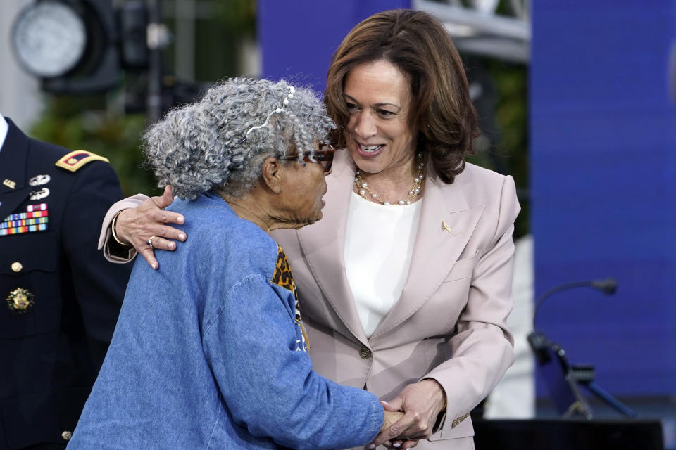 Vice President Kamala Harris welcomes Opal Lee to the stage during a Juneteenth concert on the South Lawn of the White House in Washington, Tuesday, June 13, 2023. Opal Lee is considered the grandmother of Juneteenth. (AP Photo/Susan Walsh)