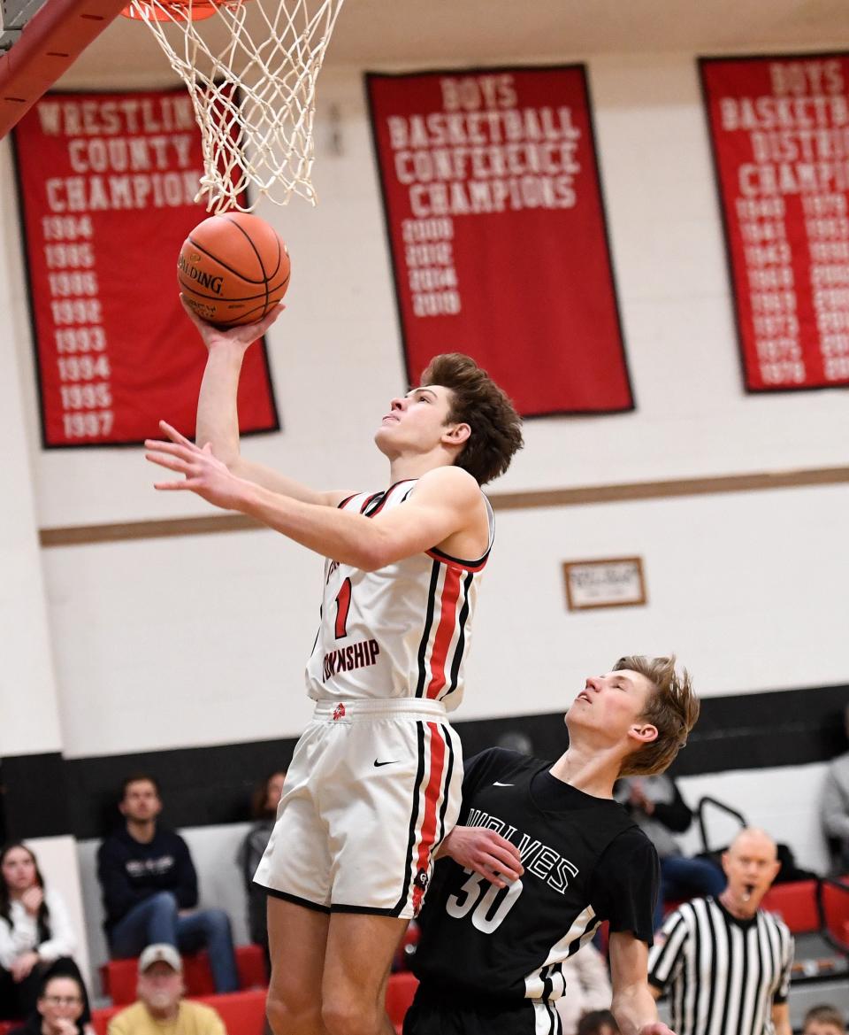 Conemaugh Township's Colin Dinyar gets inside position to the basket against West Shamokin's Travis Johns (30) during a Heritage Conference boys basketball semifinal, Feb. 5, in Davidsville.