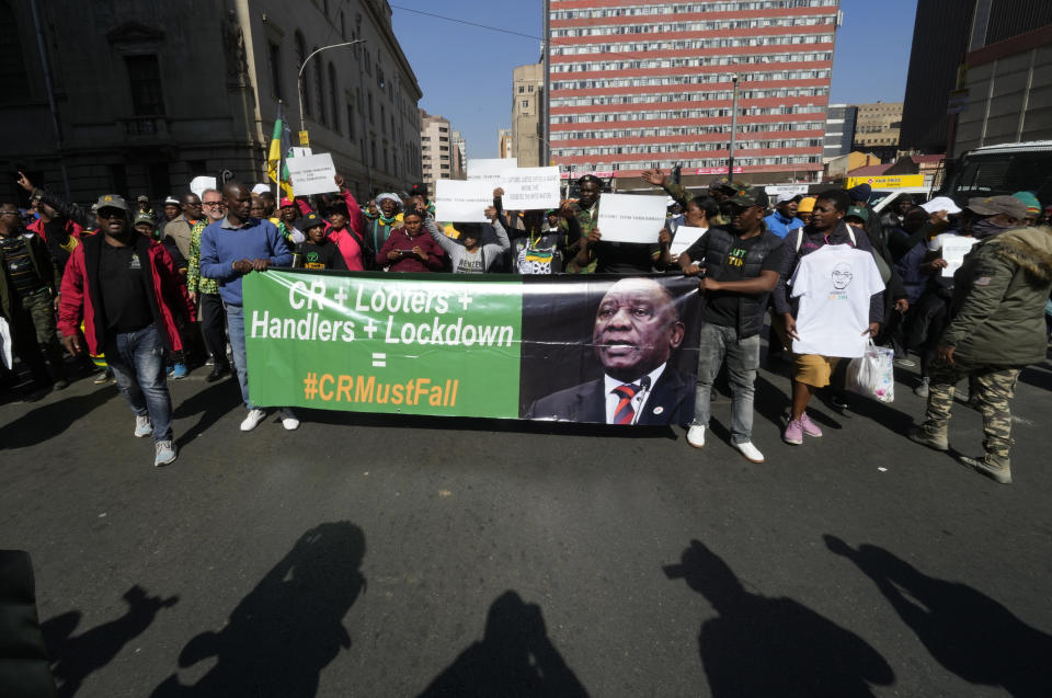 FILE - African National Congress (ANC) members protest outside the party's headquarters in Johannesburg, South Africa, July 15, 2022, to demand action be taken against President Cyril Ramaphosa over the Phala Phala farm saga. Ramaphosa is fighting for his political future in a dramatic reversal of fortunes for an anti-apartheid icon once admired for tackling the problems of Africa's most developed economy.(AP Photo/Themba Hadebe, File)