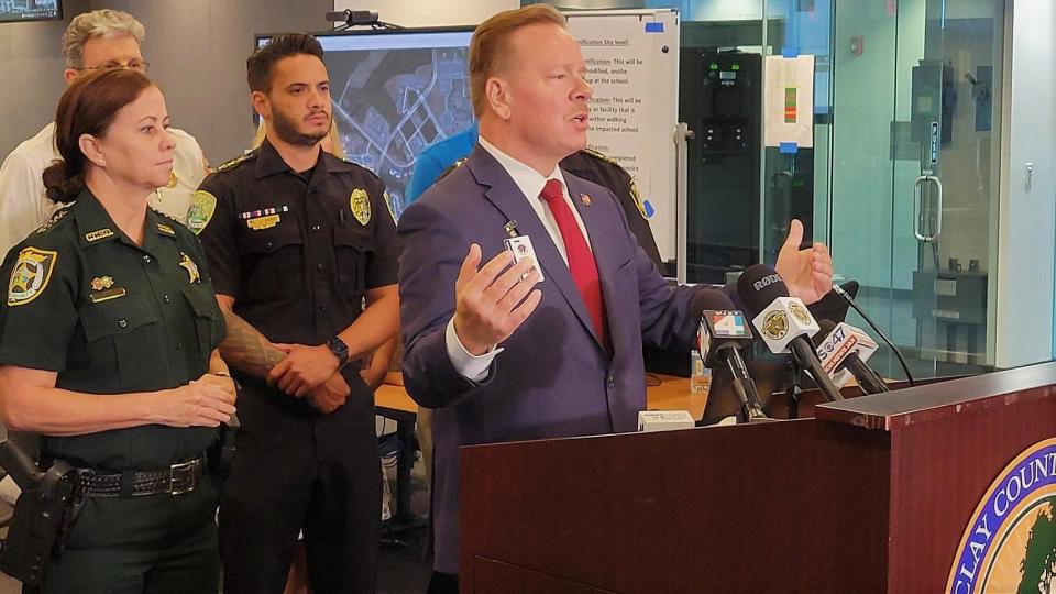 Clay County Superintendent David Broskie presents details of the county's new school hazard incident response plan at the emergency operations center. Sheriff Michelle Cook (left) and other public safety officials joined a news conference on the plan.