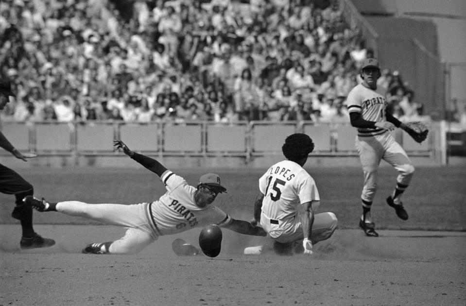 Second baseman Davey Lopes of the Dodgers slides safely into second base on a steal against the Pittsburgh Pirates