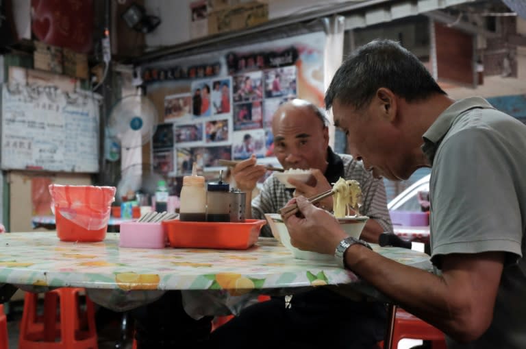 His family's noodle cart gives away free meals to those who can't afford them, paid for by those who can