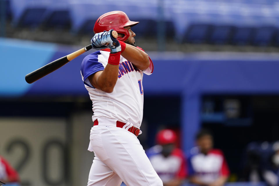 Dominican Republic's Melky Cabrera follows through after hitting an RBI-single during a baseball game against Mexico at Yokohama Baseball Stadium during the 2020 Summer Olympics, Friday, July 30, 2021, in Yokohama, Japan. (AP Photo/Matt Slocum)