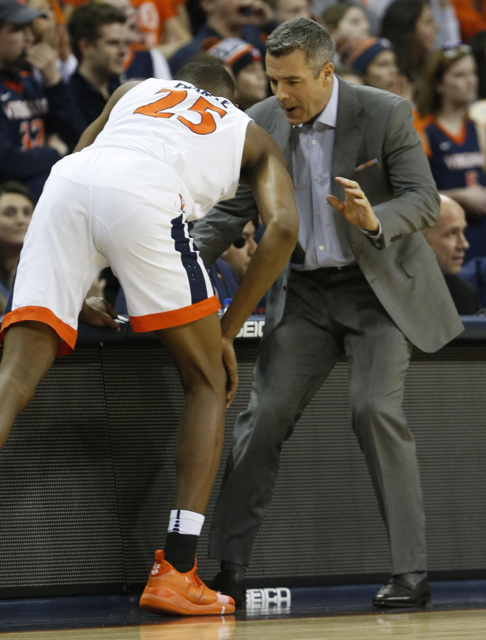 Virginia head coach Tony Bennett instructs Virginia forward Mamadi Diakite (25) during the first half of an NCAA college basketball game against Virginia Tech, in Charlottesville, Va., Tuesday, Jan. 15, 2019. (AP Photo/Steve Helber)