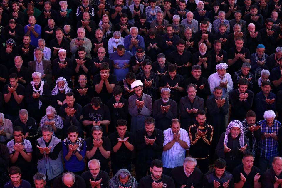 Shiite Muslim worshippers pray inside the holy shrine of Imam Abbas to mark the Muslim festival of Arbaeen in Karbala, Iraq, Sunday, Oct. 28, 2018. The holiday marks the end of the forty day mourning period after the anniversary of the martyrdom of Imam Hussein, the Prophet Muhammad's grandson in the 7th century. (AP Photo/Hadi Mizban)