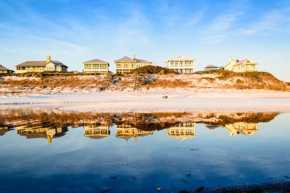 A row of two-story florida beach homes at low tide