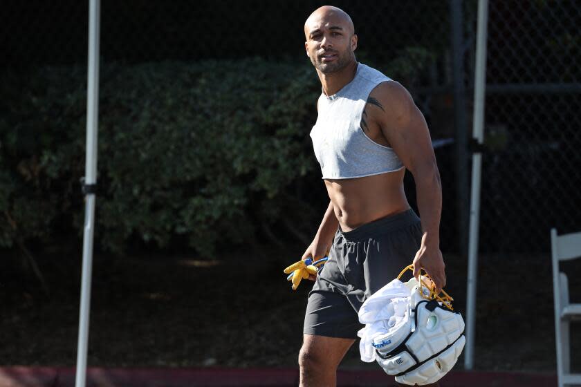 Chargers running back Austin Ekeler arrives at training camp.