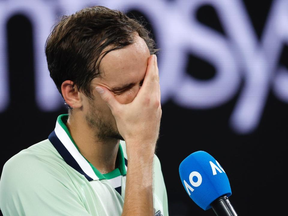 Daniil Medvedev puts his head in his hands.