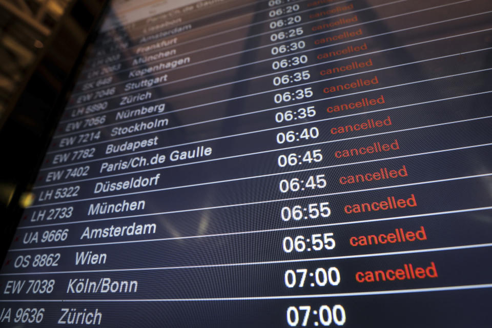 Cancelled flights are indicated on a display board at the airport in Hamburg, Germany, Tuesday, Jan. 15, 2019. Flights across Germany are facing disruption after security staff at eight airports went on strike over pay. (Christian Charisius/dpa via AP)