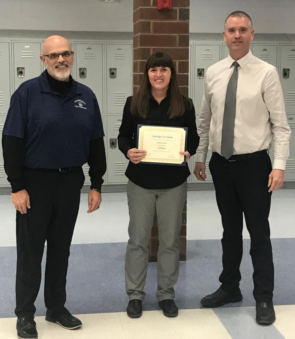 Middle school math teacher Kellie Spratt was recognized by Cambridge Middle School Principal Heath Hayes, Superintendent Dan Coffman, and the board of education for winning the CORAS Outstanding Middle School Teacher award.