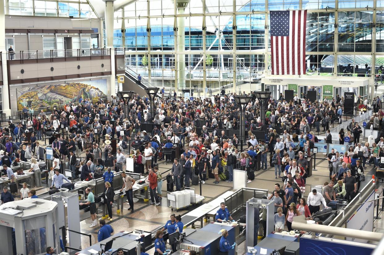 Airplane passengers line up for TSA security screenings at Denver International Airport in 2019. <a href="https://www.gettyimages.com/detail/news-photo/airplane-passengers-line-up-for-tsa-security-screenings-at-news-photo/1159430281?adppopup=true" rel="nofollow noopener" target="_blank" data-ylk="slk:Robert Alexander/Getty Images;elm:context_link;itc:0;sec:content-canvas" class="link ">Robert Alexander/Getty Images</a>