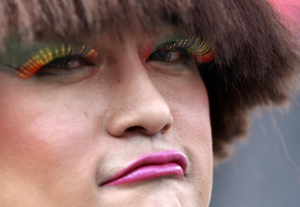 A participant poses with rainbow-colored eyelashes during the Taiwan LGBT Pride Parade in Taipei