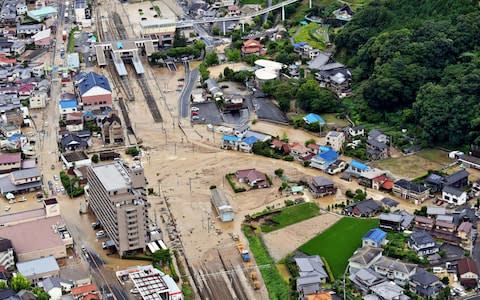 In this aerial image, JR Nose Station is submerged in Hiroshima - Credit: Getty