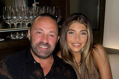 Joe Giudice and Gia Giudice smiling together at a restaurant.