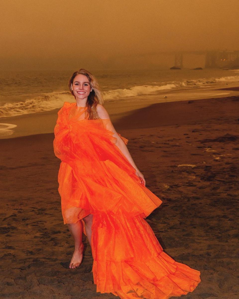 Colette LeClair in an orange dress in San Francisco